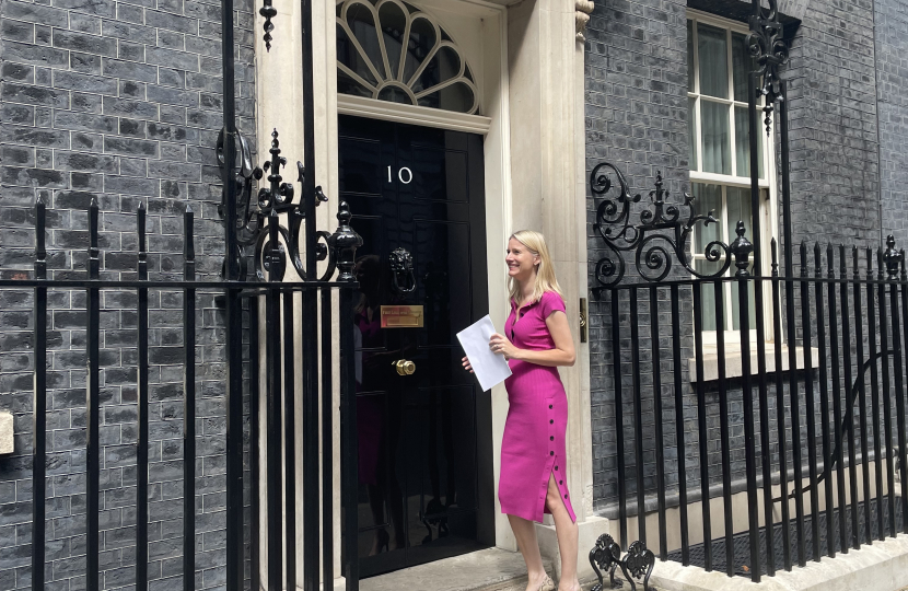 Rebecca Paul delivering Fairer Road Funding petition to No 10 June 2022