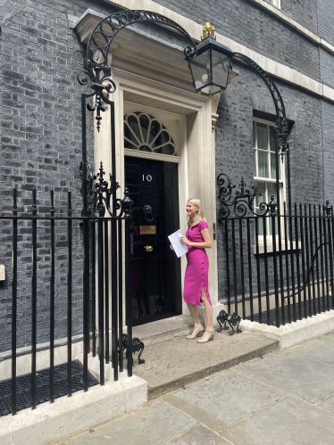 Rebecca Paul delivering Fairer Road Funding petition to No 10 June 2022